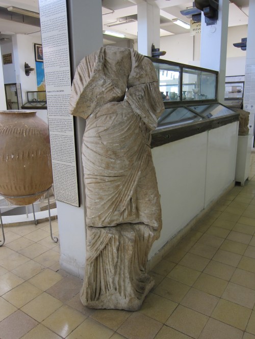 Headless statue at Jordan Archaeological Museum.