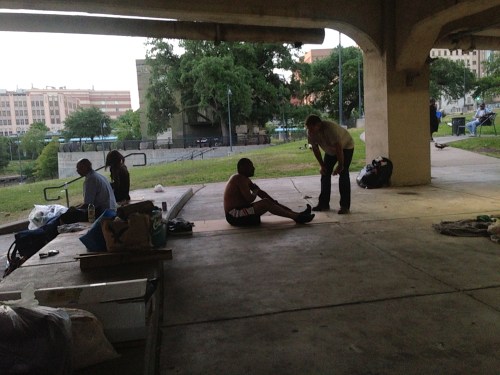 Chad talking with a homeless man at Allen's Landing.