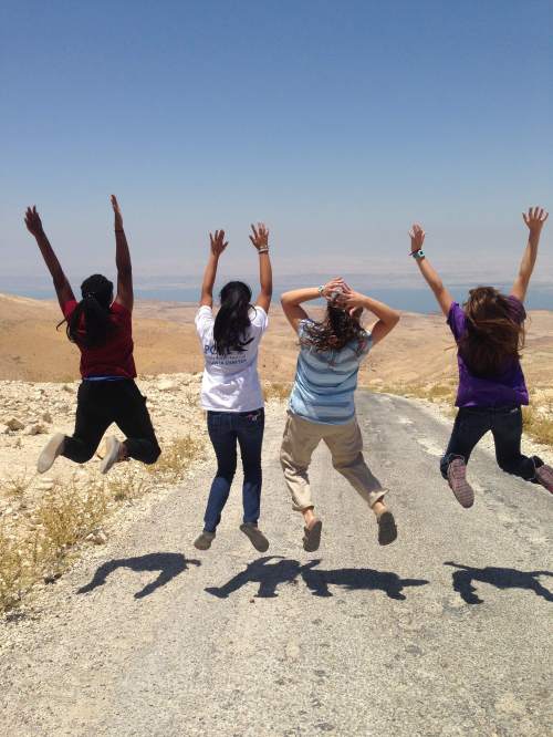 Students kicking up the dust of history near the Dead Sea.