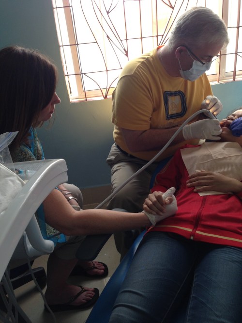 Leslie Holding Hand of Child