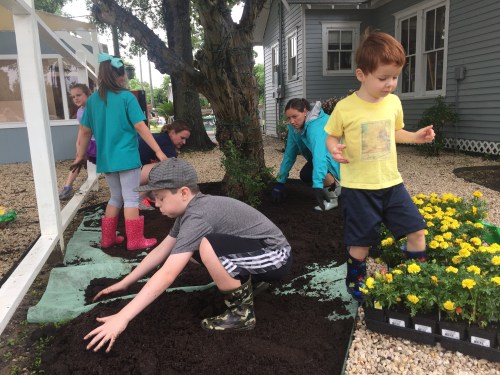 Manna House Kids Planting Flowers